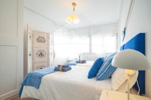 Кровать или кровати в номере Playa Apartamento Frente al mar