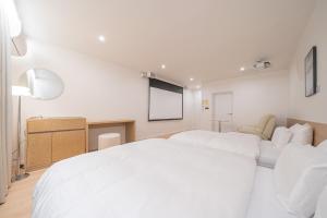 Aank Hotel Cheongju Uam 1st客房内的一张或多张床位