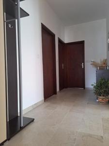 a hallway with two doors and a tile floor at Apartment Rita in Dramalj