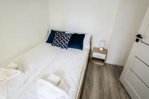 Postel nebo postele na pokoji v ubytování Apartament Kochanowskiego