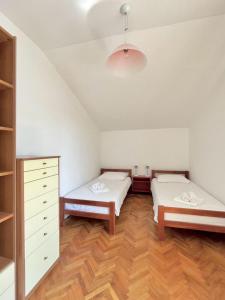Posteľ alebo postele v izbe v ubytovaní Lemon Tree Apartments