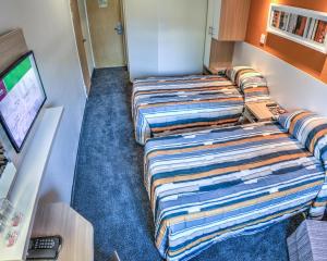 Katil atau katil-katil dalam bilik di Road Lodge Germiston