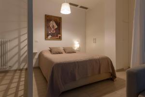 A bed or beds in a room at Casa Aleardi grazioso e nuovissimo monolocale con balcone