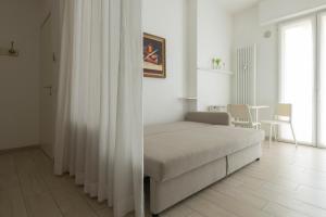 A bed or beds in a room at Casa Aleardi grazioso e nuovissimo monolocale con balcone