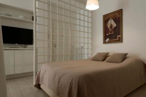 A bed or beds in a room at Casa Aleardi grazioso e nuovissimo monolocale con balcone
