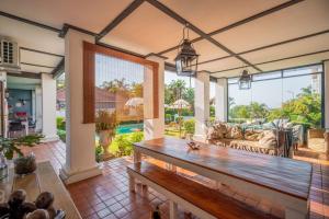 a living room with a table and a couch at Holland House B&B in Durban