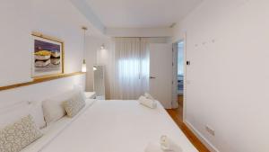 Кровать или кровати в номере Apartamentos La Casa El Palo