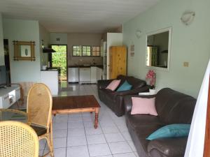 a living room with a couch and a table at Eden Wilds 30 in Port Edward