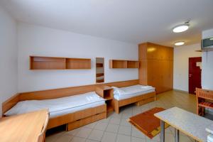 Postel nebo postele na pokoji v ubytování Campus Hotel