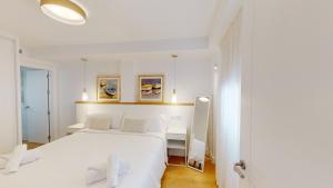 Кровать или кровати в номере Apartamentos La Casa El Palo