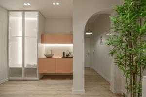 a kitchen with a sink and a refrigerator at No125 - City Centre Room Apartment in Orestiada