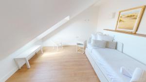 Кровать или кровати в номере Apartamentos La Casa El Palo