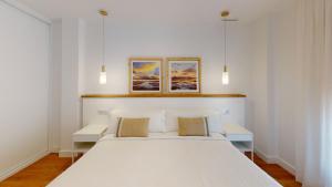 Кровать или кровати в номере Apartamentos La Casa El Palo