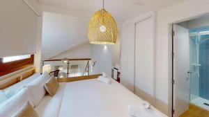 Кровать или кровати в номере Apartamentos La Casa El Palo