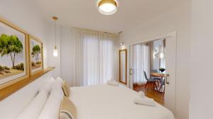 Кровать или кровати в номере Apartamentos La Casa El Palo