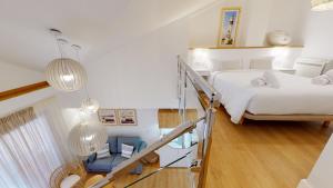 Кровать или кровати в номере Apartamentos La Casa El Palo