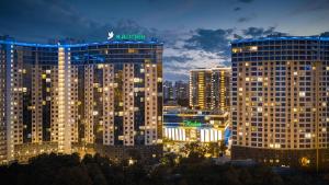 a large building with a sign on top of it at Arcadia Sweet LOFT Style! in Odesa