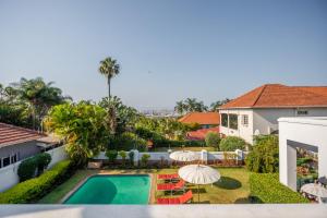 an aerial view of the backyard of a house with a swimming pool at Holland House B&B in Durban