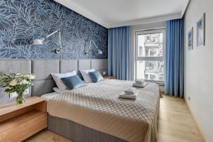 Łóżko lub łóżka w pokoju w obiekcie Blue Mandarin Marina