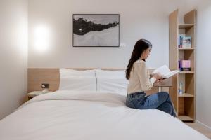 Aank Hotel Cheongju Uam 2nd客房内的一张或多张床位