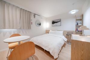 Aank Hotel Cheongju Uam 2nd客房内的一张或多张床位