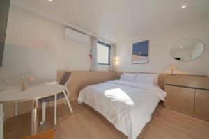 Aank Hotel Cheongju Uam 2nd客房内的一张或多张床位