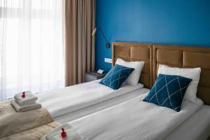 4Wings Apartments客房内的一张或多张床位
