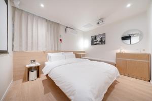 Aank Hotel Cheongju Uam 2nd客房内的一张或多张床位