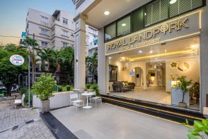 a store front of a mall with chairs and tables at The Royal LandPark - Phu My Hung in Ho Chi Minh City