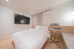 Aank Hotel Cheongju Uam 2nd客房内的一张或多张床位