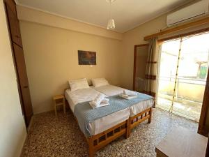 Postel nebo postele na pokoji v ubytování Villa Froso