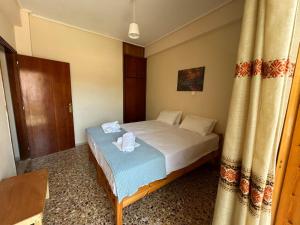 Postel nebo postele na pokoji v ubytování Villa Froso