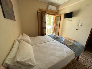 Postel nebo postele na pokoji v ubytování Villa Froso