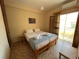 Postel nebo postele na pokoji v ubytování Villa Froso