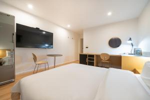 Sjónvarps- og/eða afþreyingartæki á Aank Hotel Daejeon Yongjeon 2nd