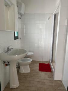 Koupelna v ubytování Residence Nido Verde + 71 fotografií