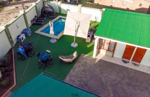 an overhead view of a house with a swimming pool at The Clan Guest House in Maseru