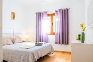 Postel nebo postele na pokoji v ubytování Live Caletillas Taunus