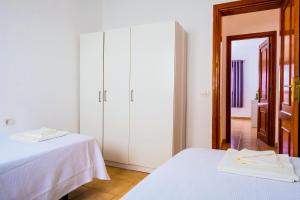 Postel nebo postele na pokoji v ubytování Live Caletillas Taunus
