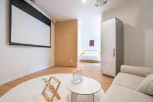 Rúm í herbergi á Aank Hotel Daejeon Yongjeon 2nd