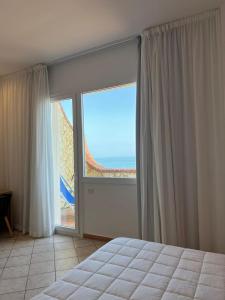 Posteľ alebo postele v izbe v ubytovaní Hotel La Martinica