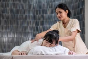 a woman in a spa giving a massage to a patient at Areca Resort and Spa - SHA Extra Plus in Kathu