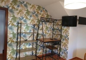 a room with a wall with a wall at Casa vacacional Mirador de San Vicente in Serdio