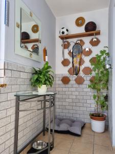 a room with a table and some plants and shelves at Cztery Kąty in Drawno