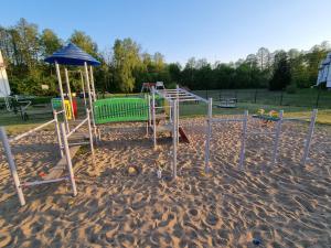 a playground in the sand in a park at Cztery Kąty in Drawno
