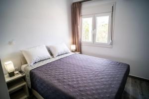 Ένα ή περισσότερα κρεβάτια σε δωμάτιο στο Villa Ble Paros 2