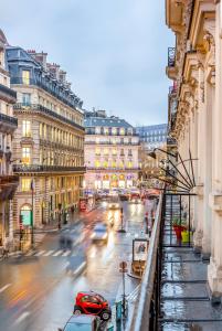 a busy city street with cars and buildings at Quatre Septembre in Paris