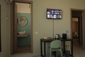 TV tai viihdekeskus majoituspaikassa Sikelìa Bed & Breakfast