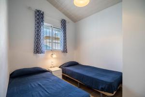 Postel nebo postele na pokoji v ubytování La Casita Azul - Mayores de 25 + 15 fotografií