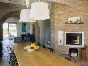 a bowl of fruit on a wooden table in a living room at Casa Bartoccio - Casa vacanze in Fermignano